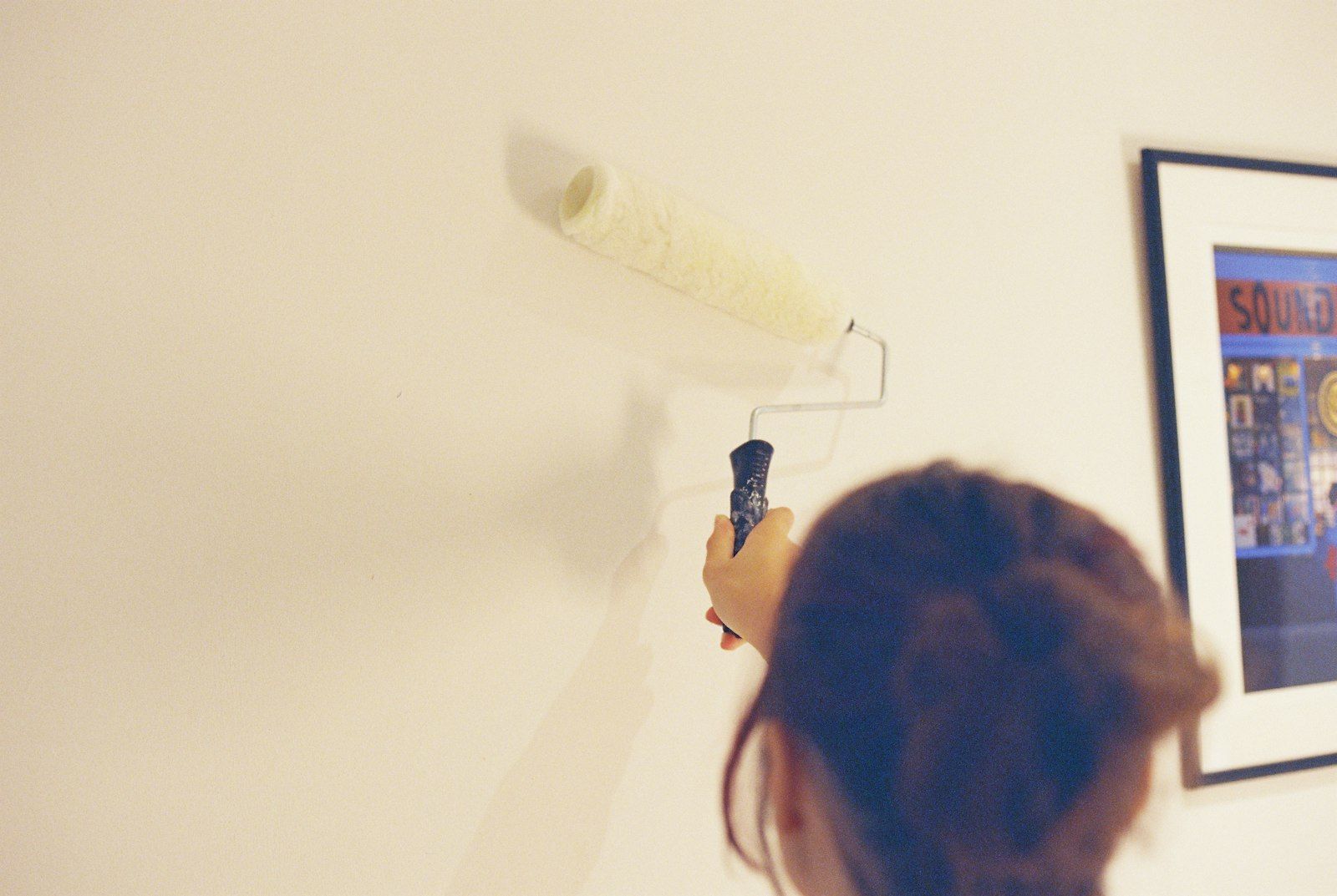 Painting an interior wall with a roller