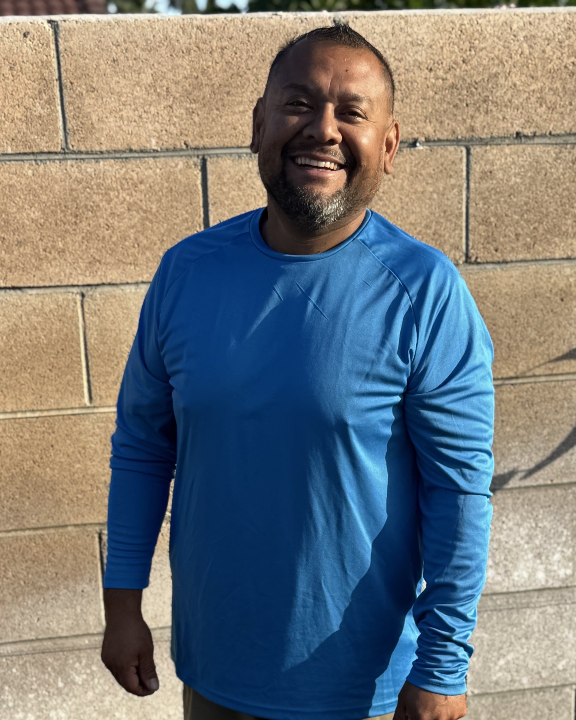 The owner of Desert Pool and Home Solutions smiling in the sun