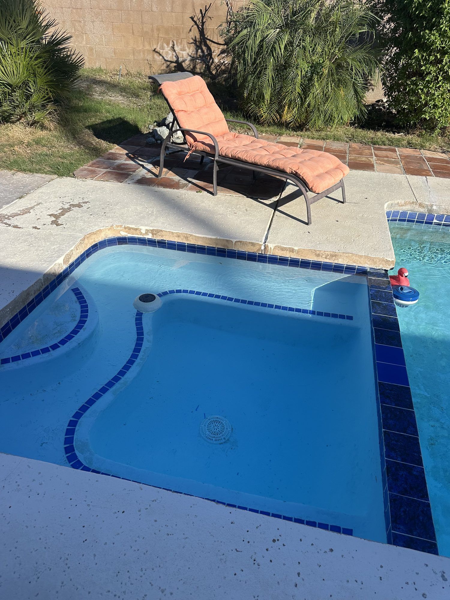 The same spa with clean tile and clear water after cleanup